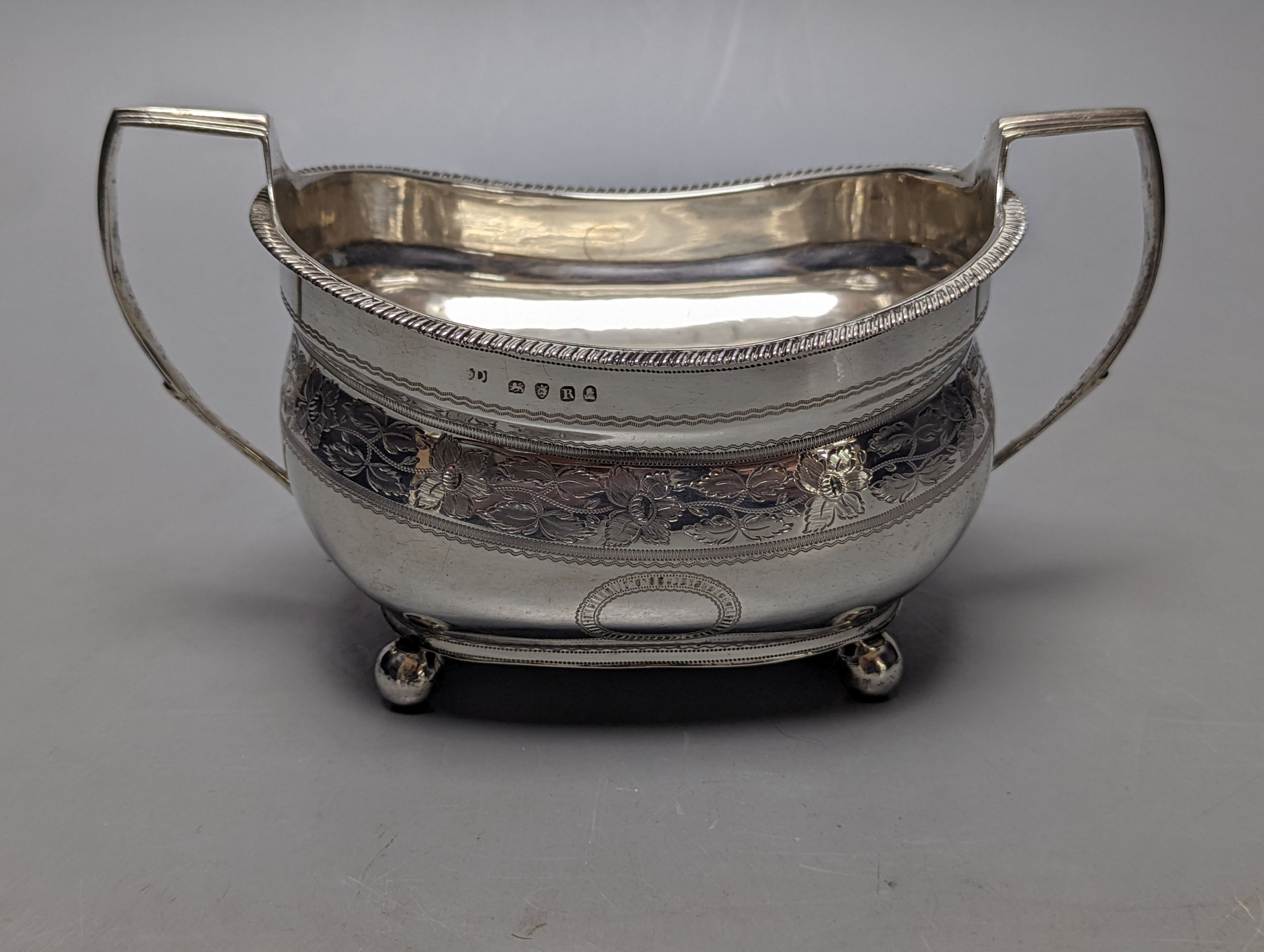 A George III engraved silver two handled sugar bowl, maker ?D, London, 1812, width 19cm